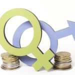 pile-coins-woman-man-gender-symbols-copy-space